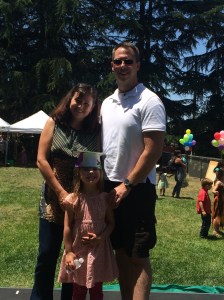 My wife and I with our preschool graduate. Next stop: Stanford. Or Washington State, like her dad.